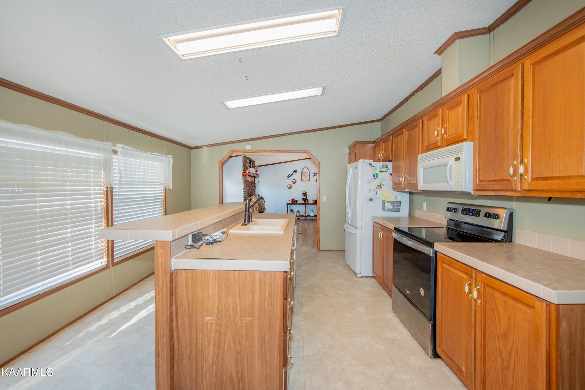 2382 River Road Kingston, TN 37763 - Photo 51 of 60 a kitchen with stainless steel appliances granite countertop sink stove top oven and refrigerator