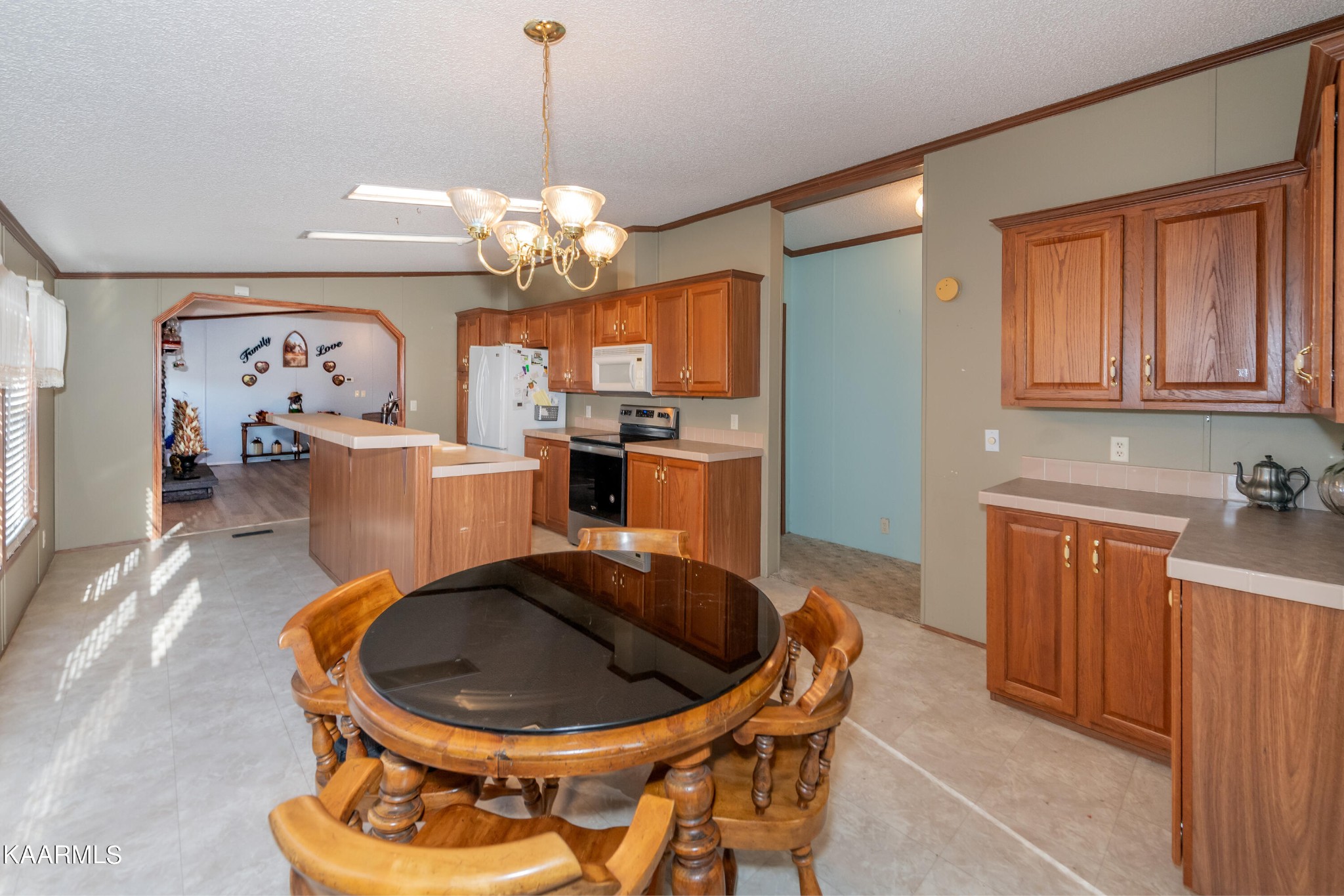 2382 River Road Kingston, TN 37763 - Photo 52 of 60 a very nice looking dining room with a chandelier