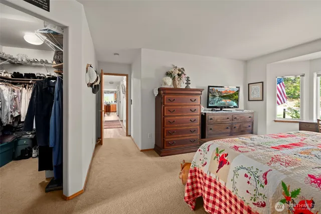 a bathroom with a bathtub and a potted plant