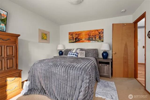 a view of a chairs and table in patio with wooden fence