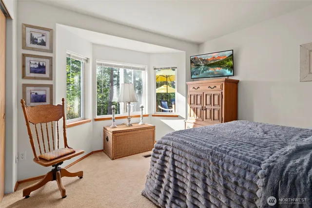 a view of a living room and a wooden deck