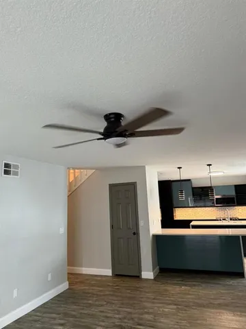 a view of room with wooden floor