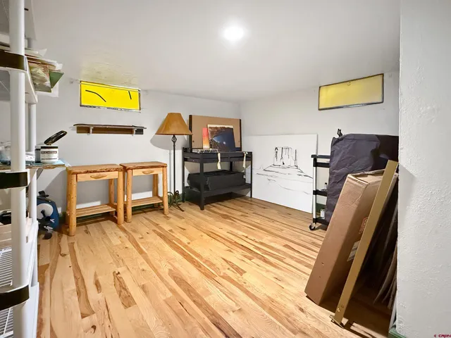 a bedroom with furniture and a bed