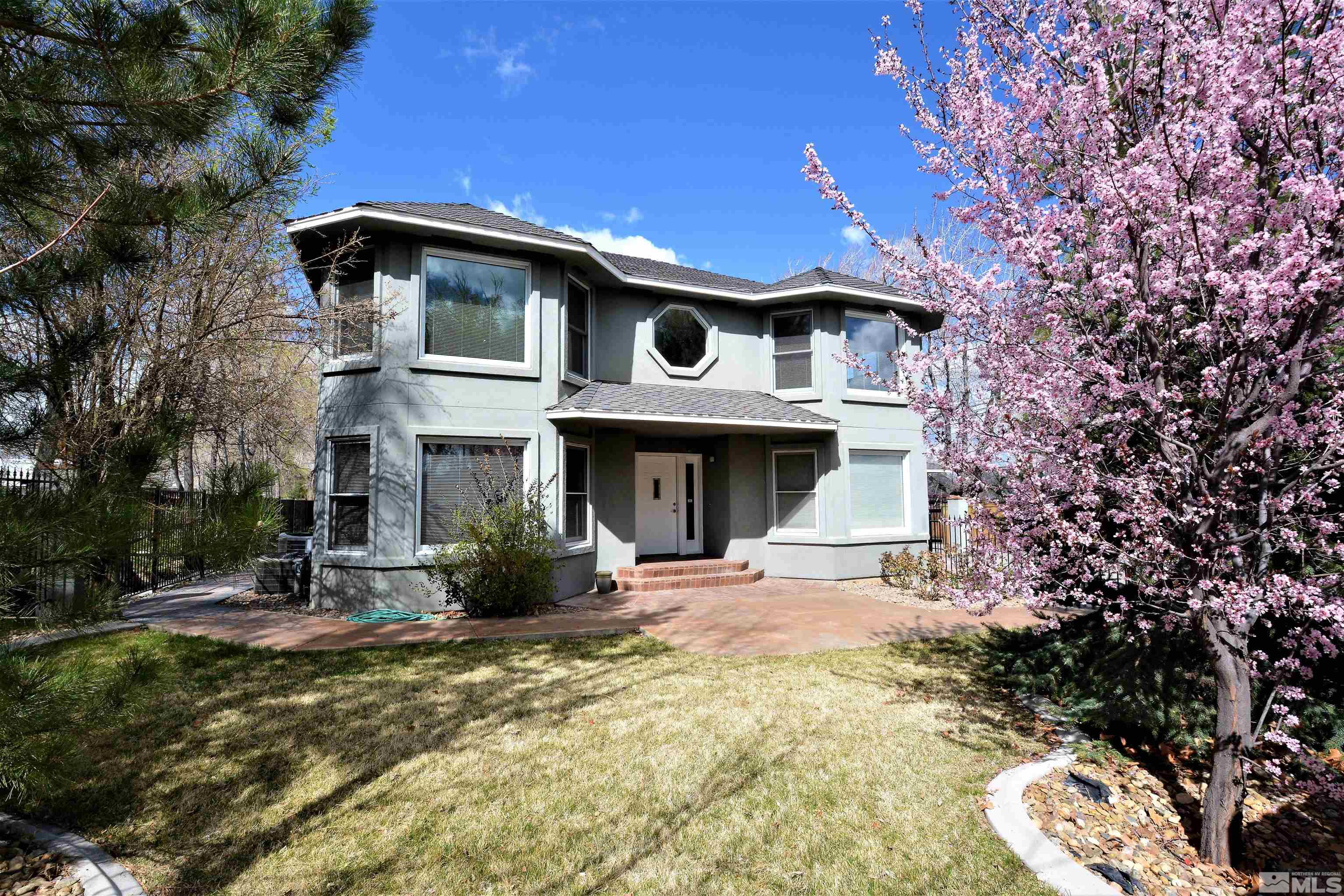 a front view of a house with yard