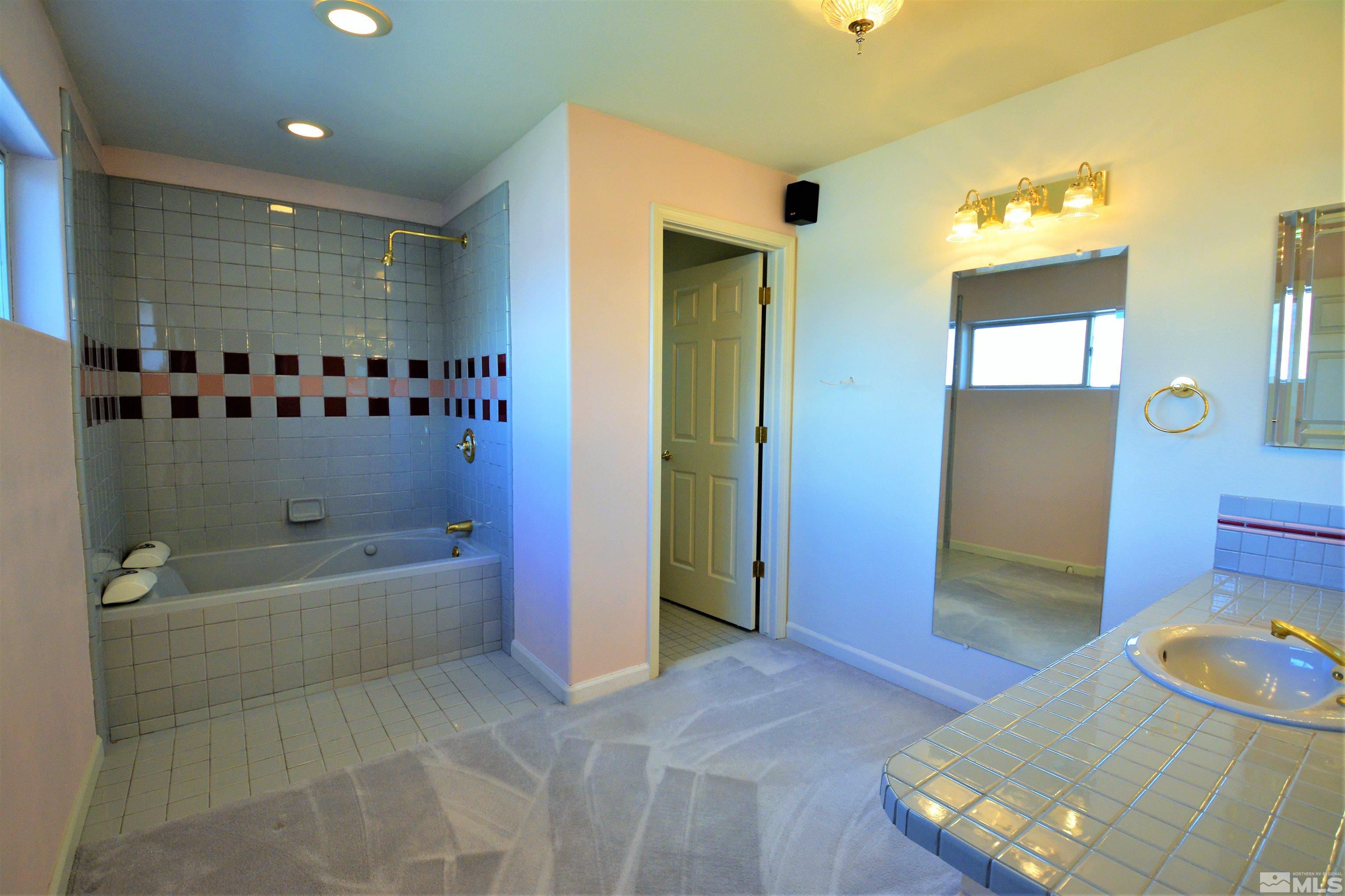 545 Skyline Boulevard Reno, NV 89509 - Photo 23 of 39 a bathroom with a sink a toilet and shower