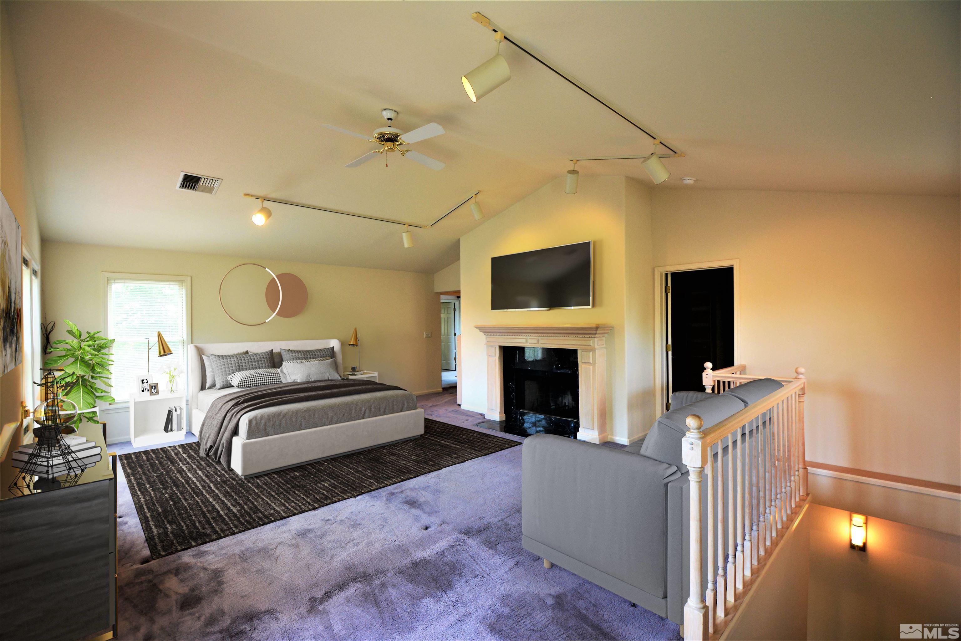 545 Skyline Boulevard Reno, NV 89509 - Photo 33 of 39 a living room with furniture and a flat screen tv