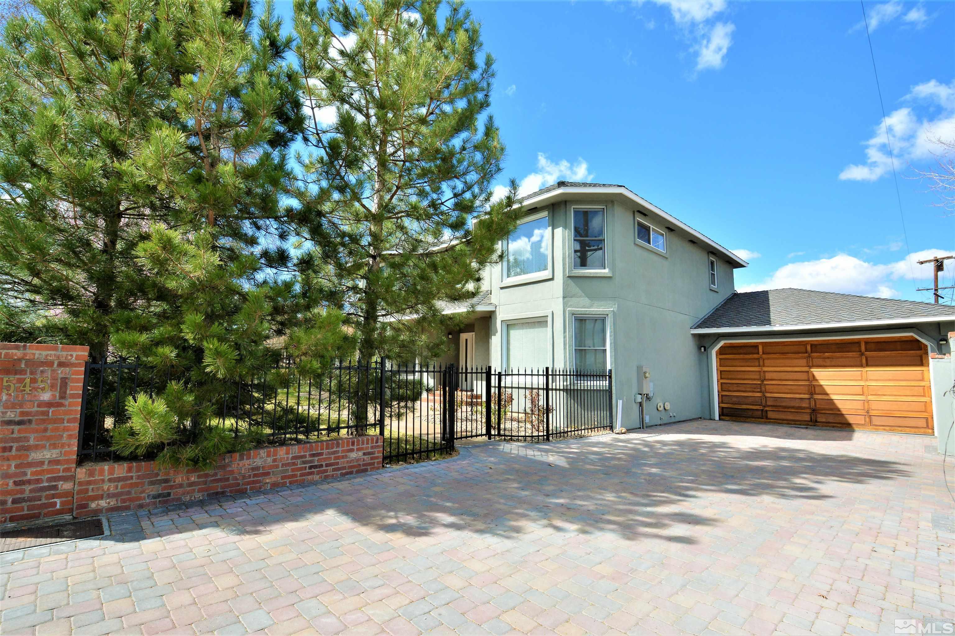 545 Skyline Boulevard Reno, NV 89509 - Photo 4 of 39 a front view of a house with a yard