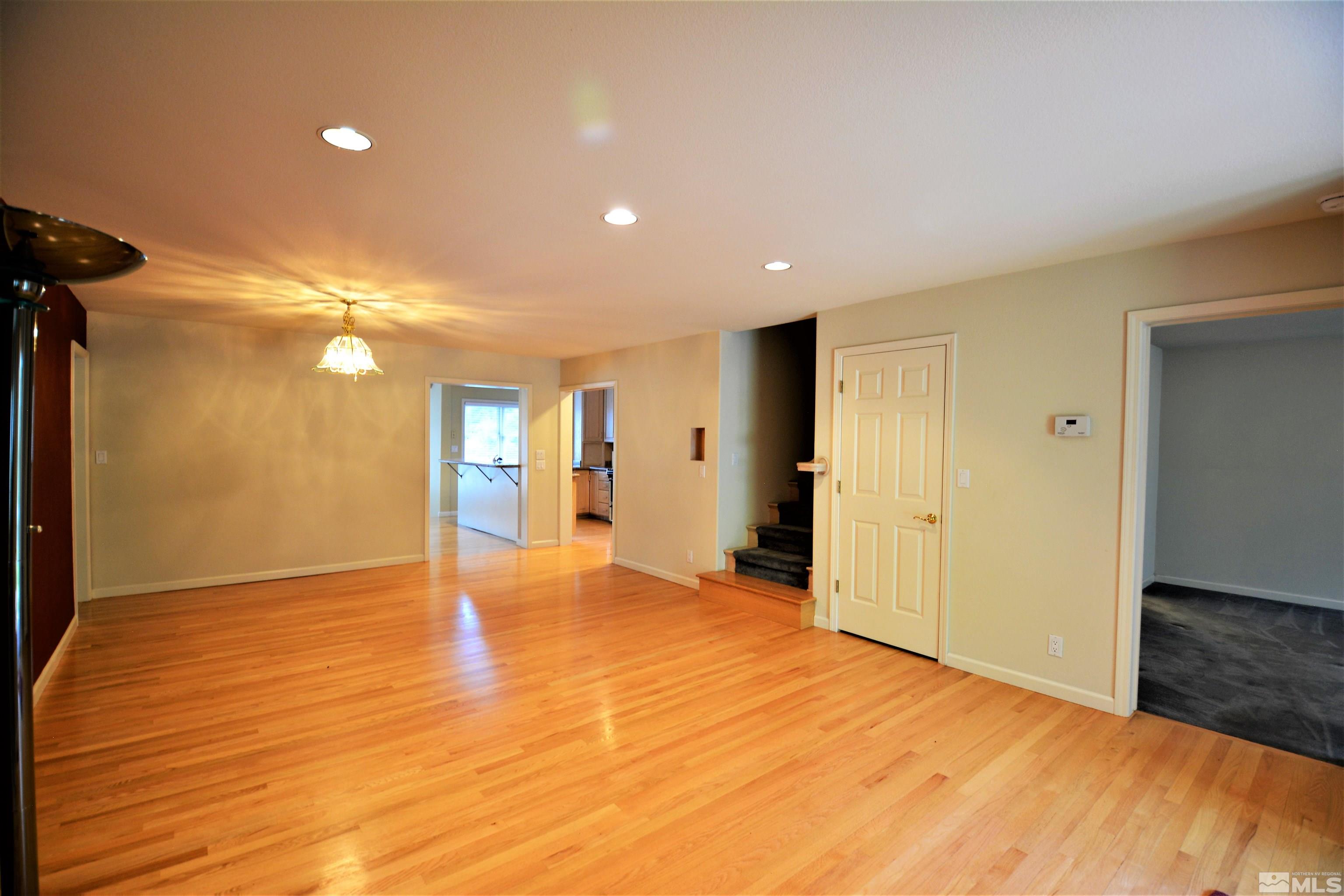545 Skyline Boulevard Reno, NV 89509 - Photo 6 of 39 a view of empty room with wooden floor