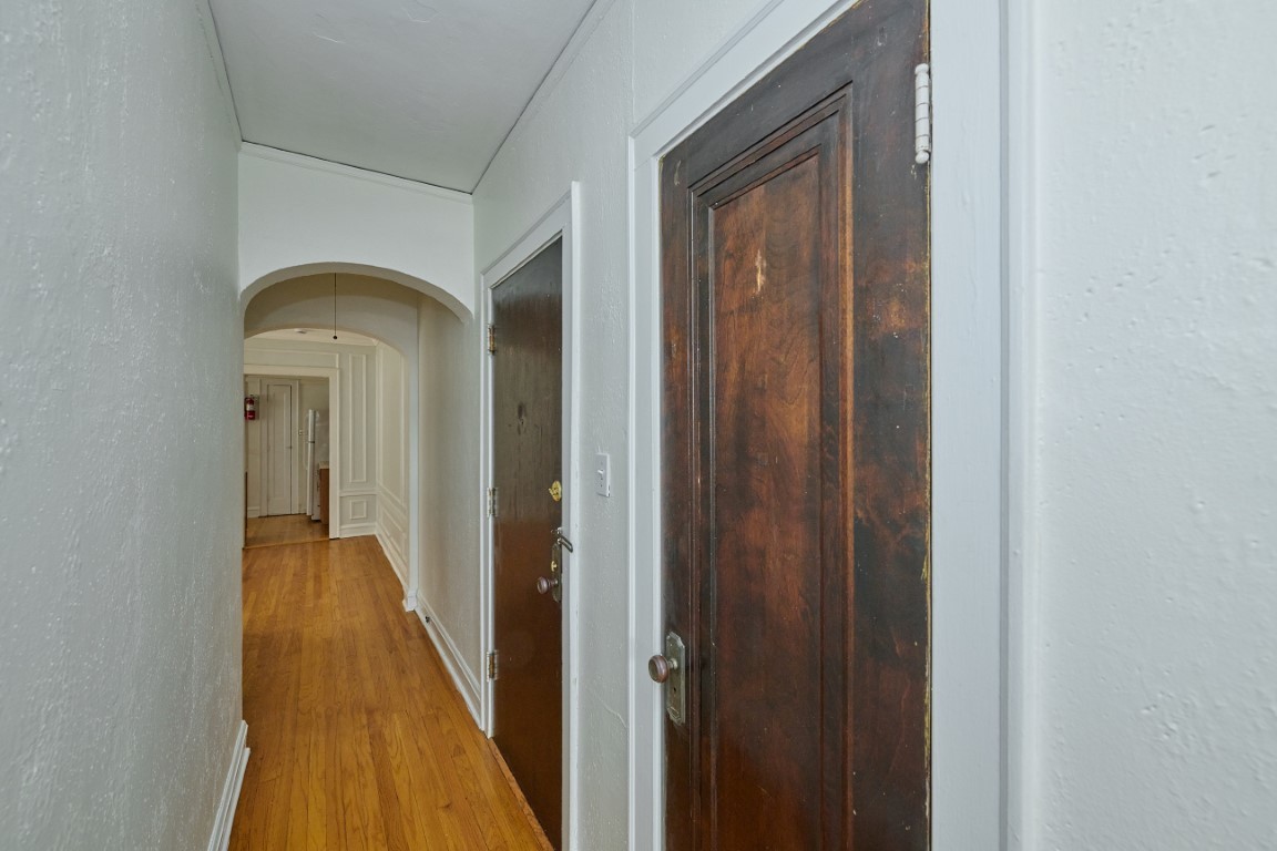 1112 Grove Street, Unit 2B Evanston, IL 60201 - Photo 7 of 21 a view of a hallway with wooden floor