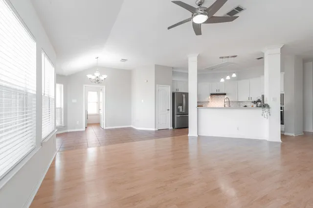 a view of a kitchen with a sink and a window