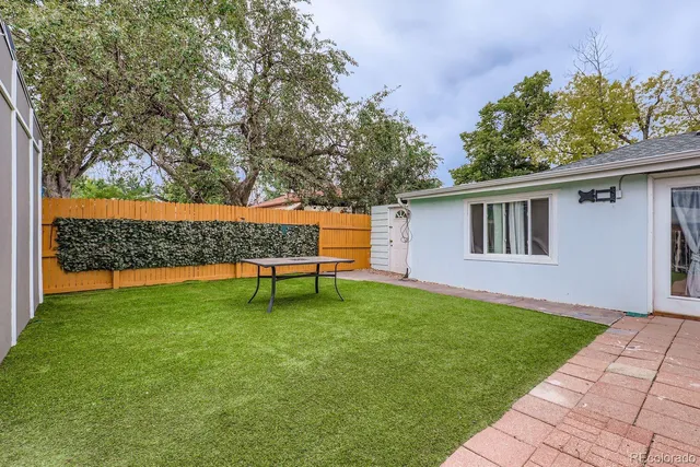 a view of backyard with a garden and entertaining space