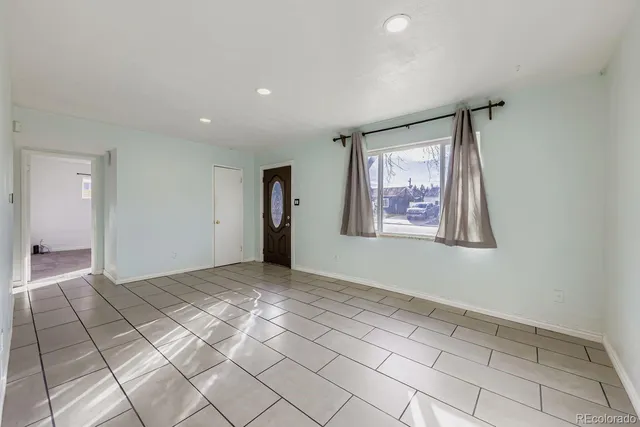 a view of an empty room and window