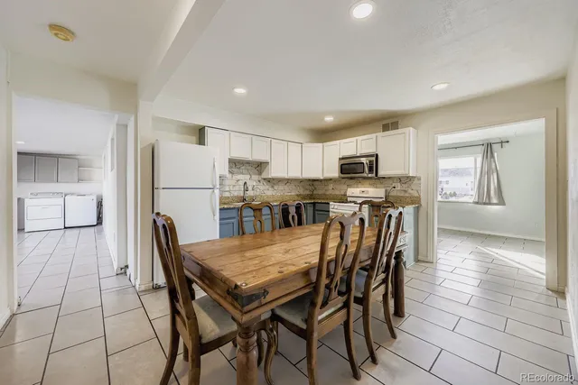 a view of a dining room with furniture