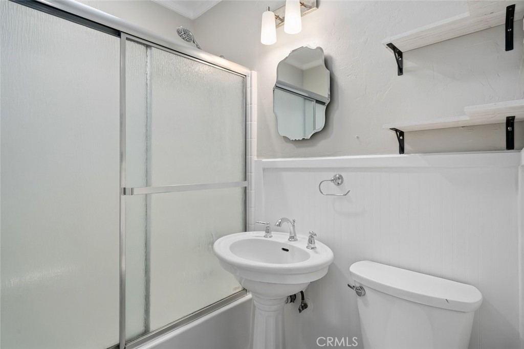 273 Pacific Avenue Paso Robles, CA 93446 - Photo 14 of 32 a bathroom with a sink toilet and a mirror