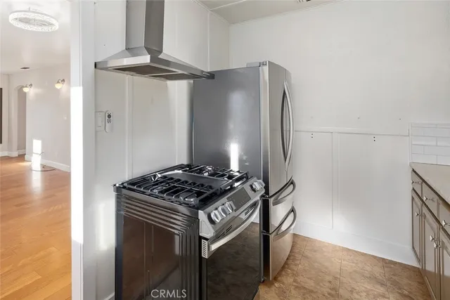 a stove top oven sitting inside of a kitchen