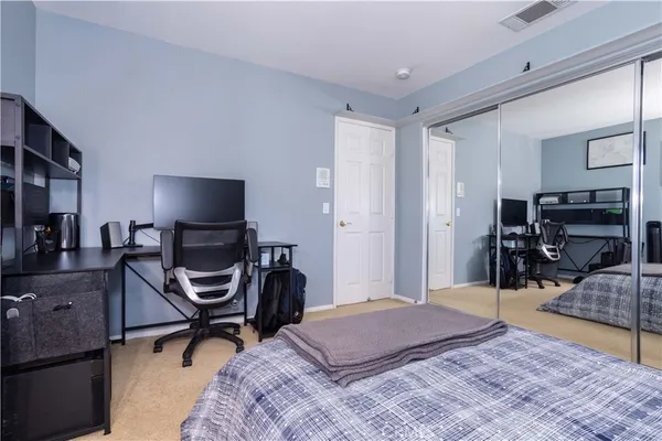 a bedroom with a bed and a table in it