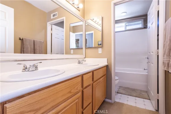 a bathroom with a bathtub and shower curtain