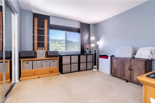 a view of a hallway with a livingroom view