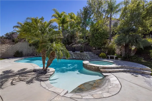 a view of a swimming pool with a yard