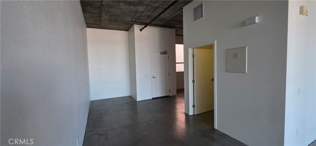 835 Locust Avenue, Unit 521 Long Beach, CA 90813 - Photo 11 of 18 a view of a hallway with wooden floor