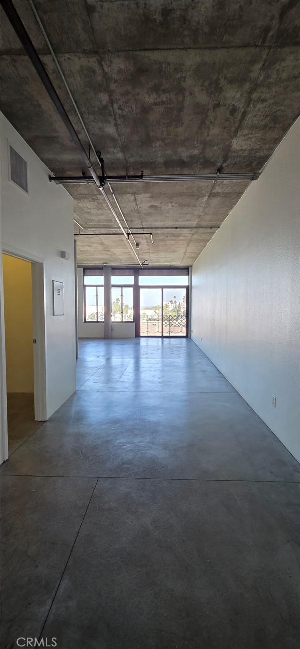 835 Locust Avenue, Unit 521 Long Beach, CA 90813 - Photo 13 of 18 a view of an empty room with wooden floor