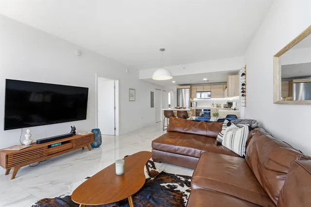 a bathroom with a tub shower and sink