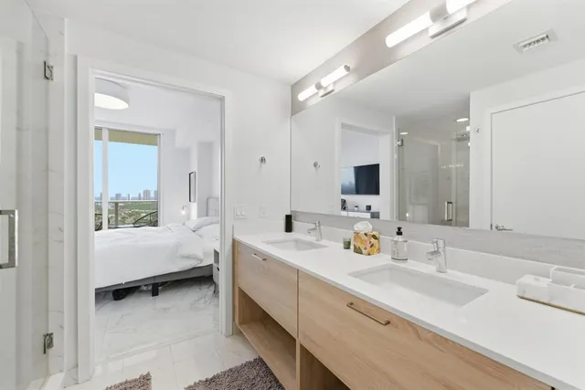 a bathroom with a toilet sink and a mirror