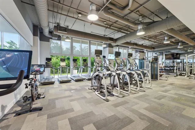 a view of a house with swimming pool and sitting area