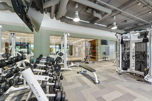 a view of a street with a cars parked front of a house