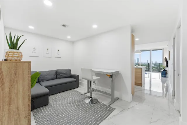 a workspace with furniture and rug