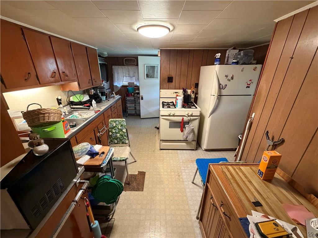 126 Hogsett Street Uniontown, PA 15401 - Photo 9 of 33 a living room with furniture and a refrigerator