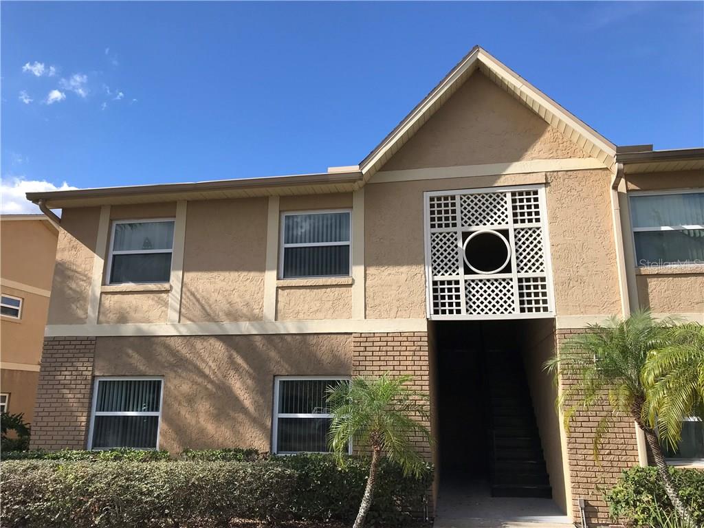 9942 Turf Way, Unit 1 Orlando, FL 32837 - Photo 1 of 1 a front view of a house with windows