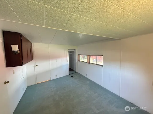 a view of a livingroom with an empty space and window