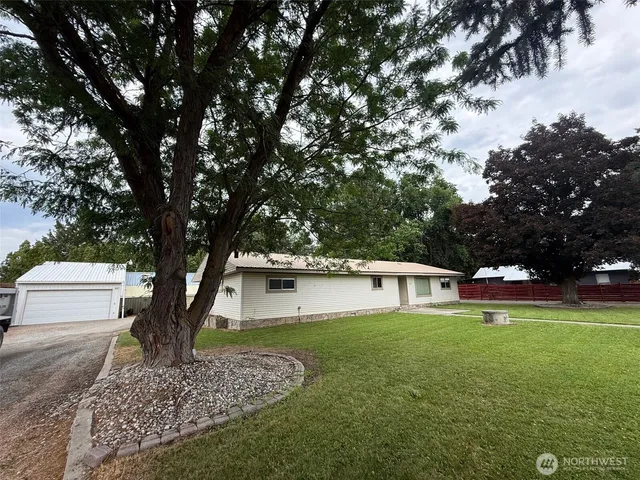 a view of a patio with table and chairs