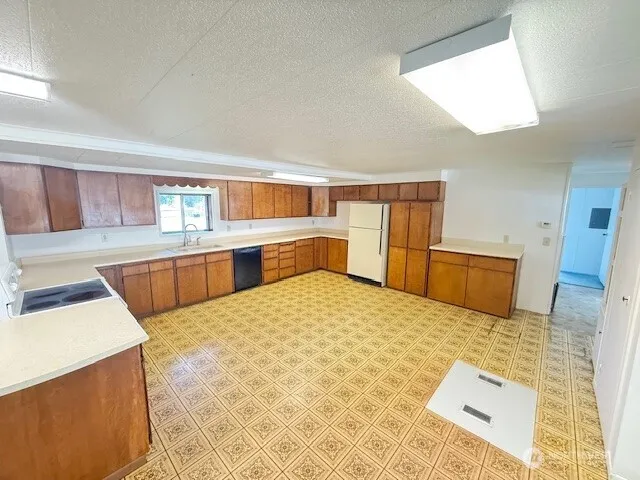 a large bedroom with a bed and furniture