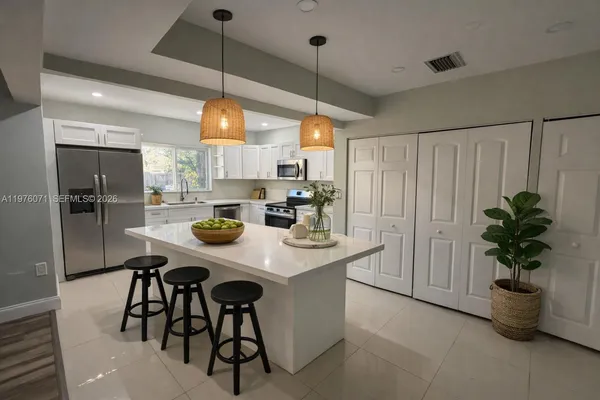 a bedroom with a bed and a ceiling fan