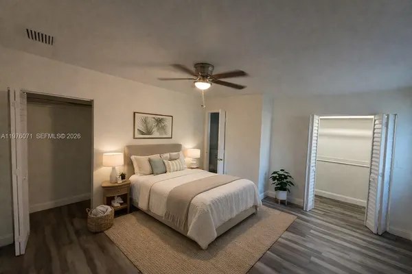 a bedroom with a bed furniture and a window