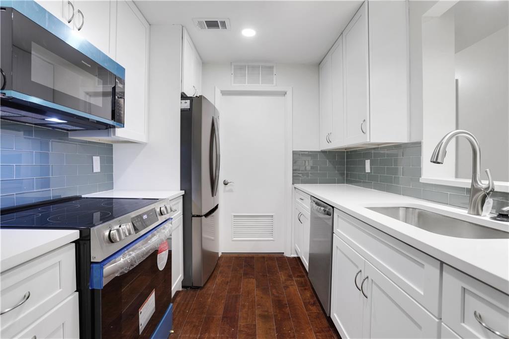 1308 McClelen Way Decatur, GA 30033 - Photo 1 of 1 a kitchen with a sink stove and refrigerator