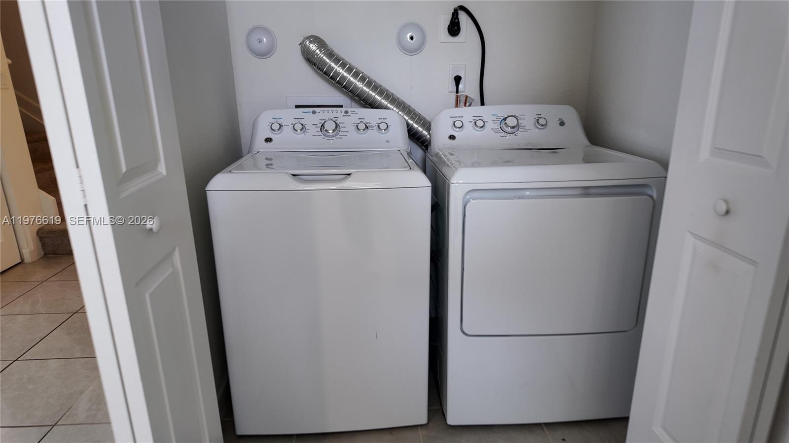 16243 Southwest 292nd Street, Unit 16243 Homestead, FL 33033 - Photo 17 of 30 a utility room with dryer and washer