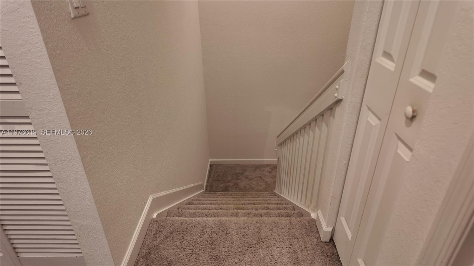 16243 Southwest 292nd Street, Unit 16243 Homestead, FL 33033 - Photo 20 of 30 a view of a hallway with stairs