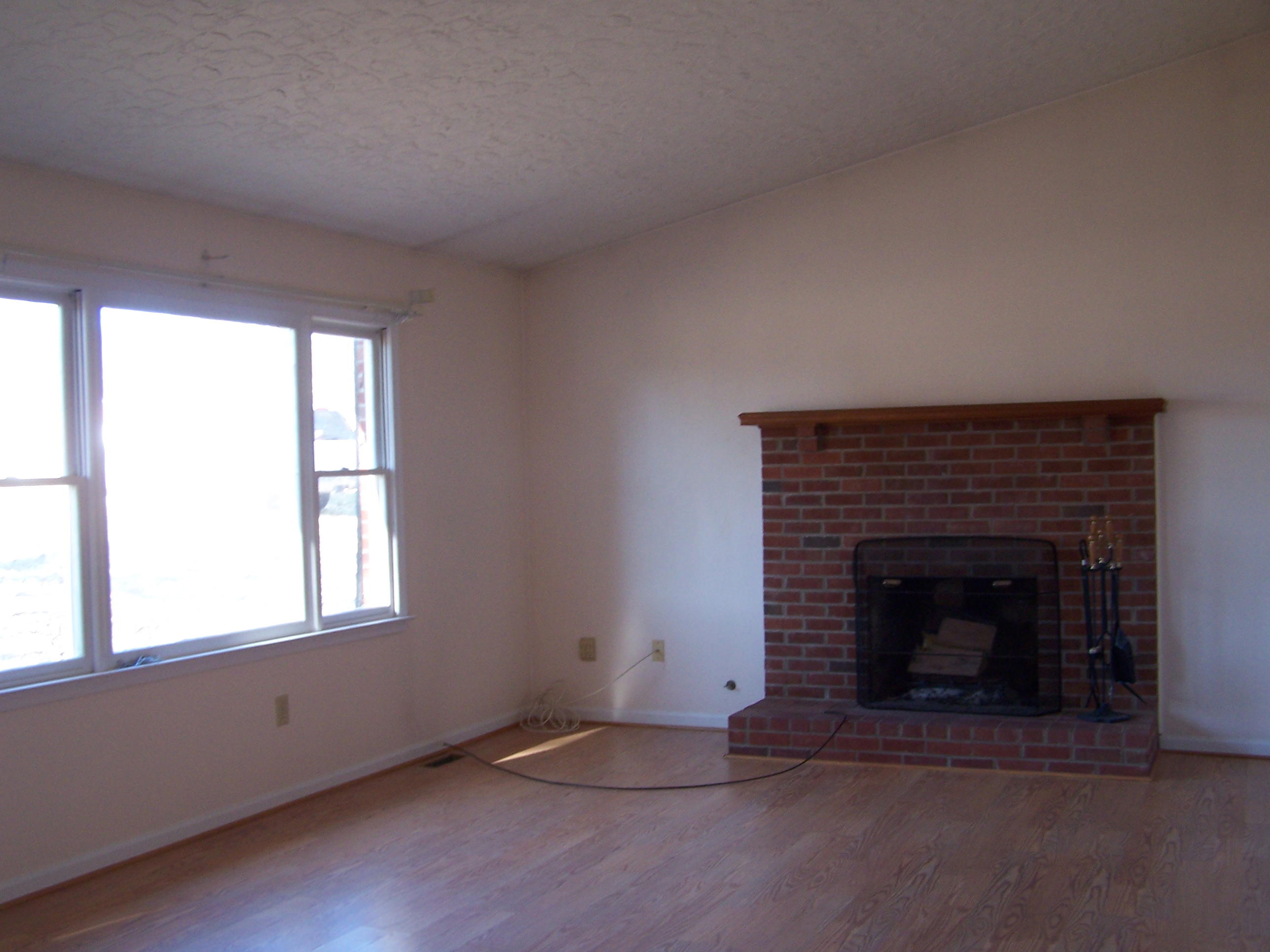 164 Fields Avenue Blue Ridge, VA 24064 - Photo 2 of 22 an empty room with a fireplace