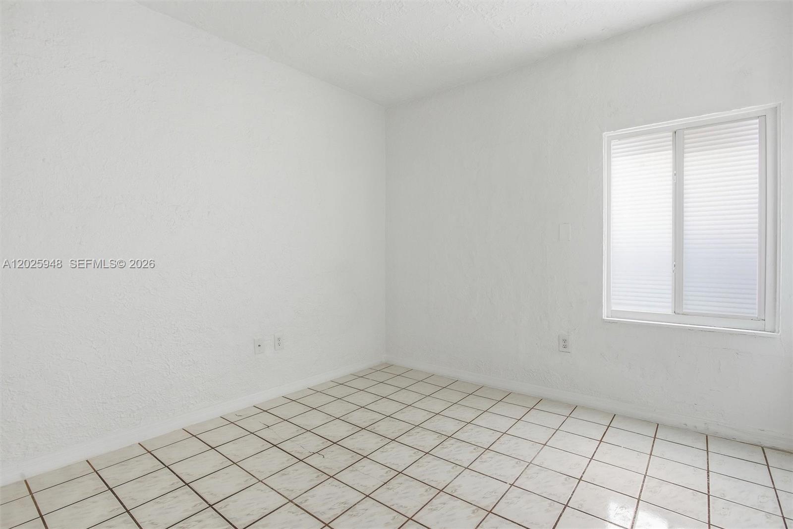 1745 Southwest 17th Street, Unit 2 Miami, FL 33145 - Photo 14 of 32 a view of an empty room and window