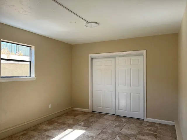 a view of an empty room with window