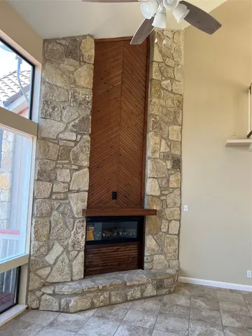 a room with a fireplace and a shower