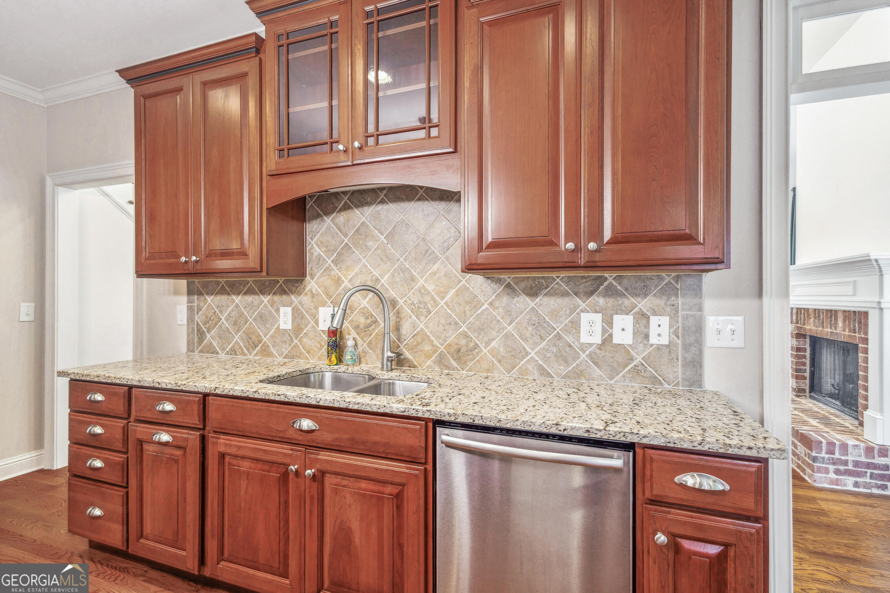 25 The Terrace Newnan, GA 30263 - Photo 15 of 58 a kitchen with granite countertop stainless steel appliances granite countertop a sink and cabinets