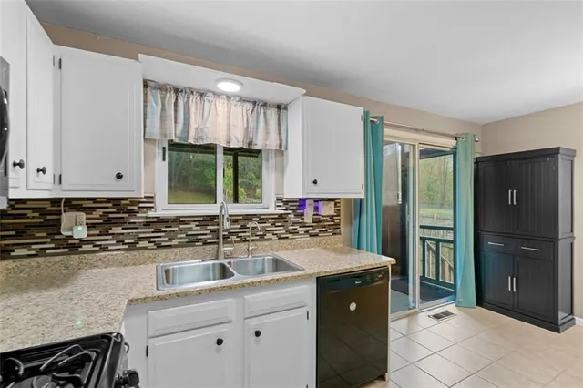 a kitchen with a sink stove and refrigerator