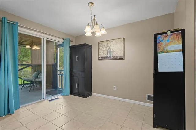 a view of an empty room with glass door