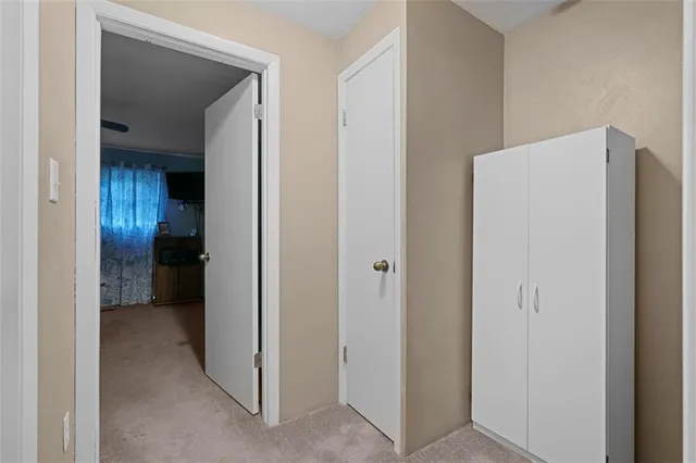 a view of a kitchen from the hallway