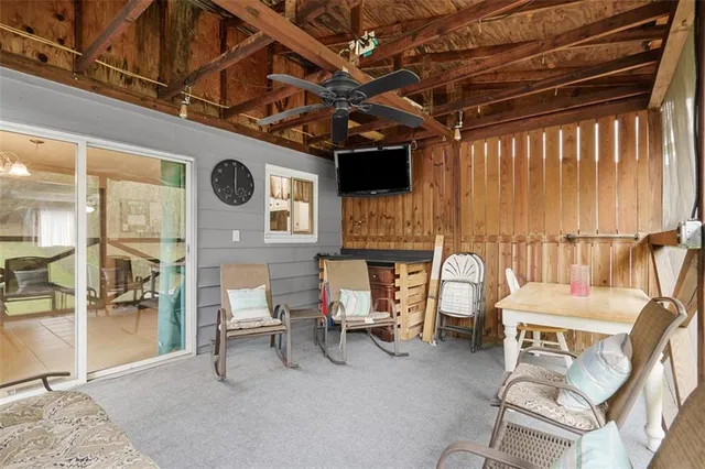 a view of a chairs and table in the room