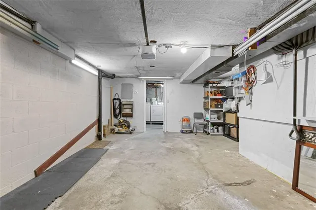 an aerial view of residential houses with outdoor space and swimming pool
